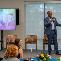 Kala Gibson addressing crowd from stage